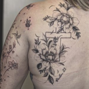 Fine line floral tattoo
