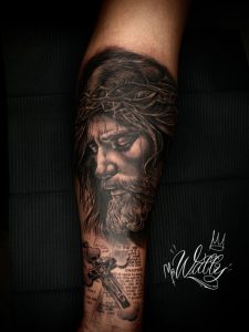 Jesus portrait forearm tattoo by Wally at Legendary Tattoos