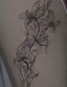 Floral fine tattoo by Lisset Raven Cabrera at Legendary Tattoos in Las Vegas.