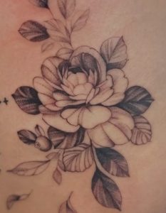 Fine line floral tattoo by Lisset Raven Cabrera at Legendary Tattoos in Las Vegas, Nevada.