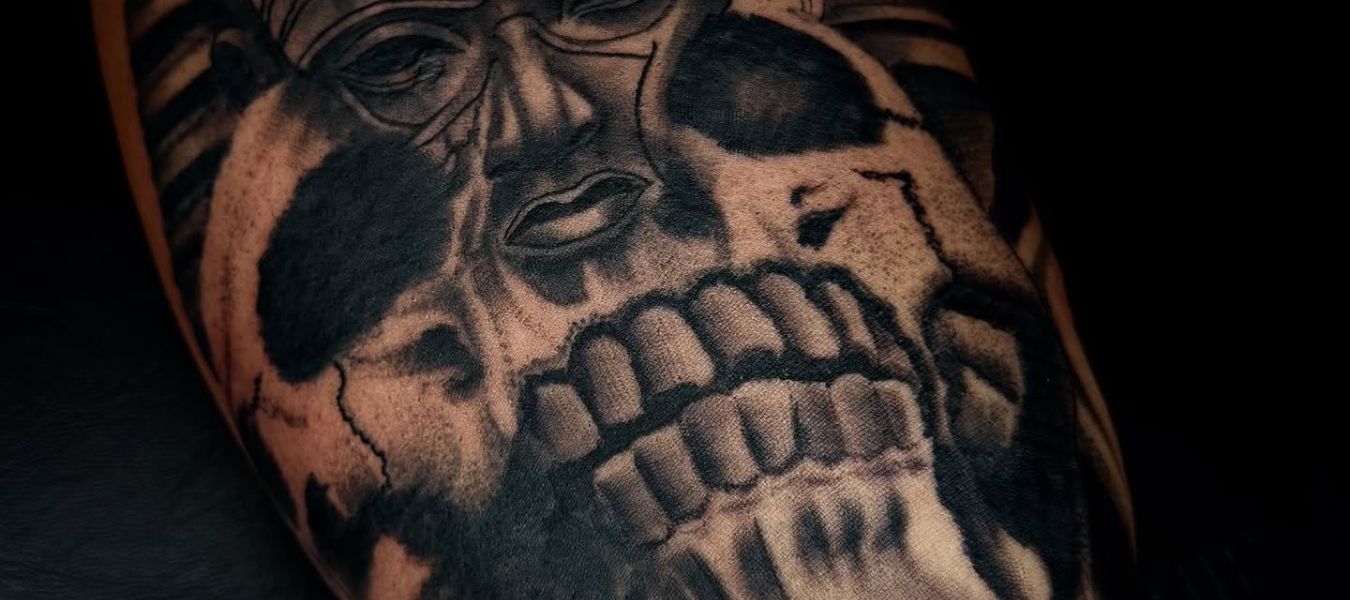 Skull Tattoo by Henry Fuentes at Legendary Tattoos in Las Vegas, Nevada. In the photo, you'll see it's a very detailed skull tattoo that's shaded with black and grey.