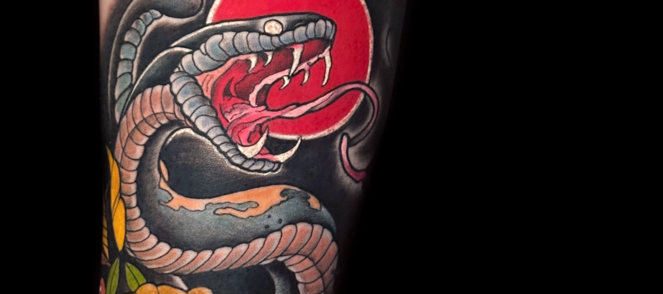 Neotradtional Tattoo of a fierce snake by Legendary Tattoos in Las Vegas.
